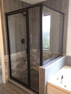 Custom glass shower enclosure designed to complement a modern bathroom layout.
