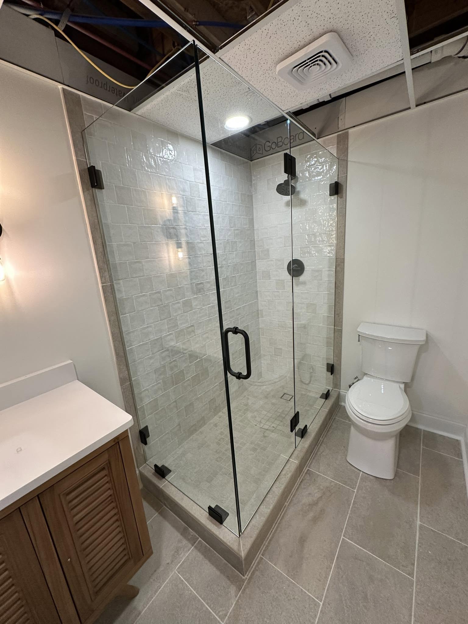 Corner frameless shower enclosure.
